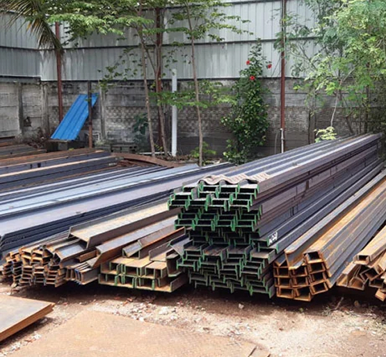 Crane loading steel at yard
